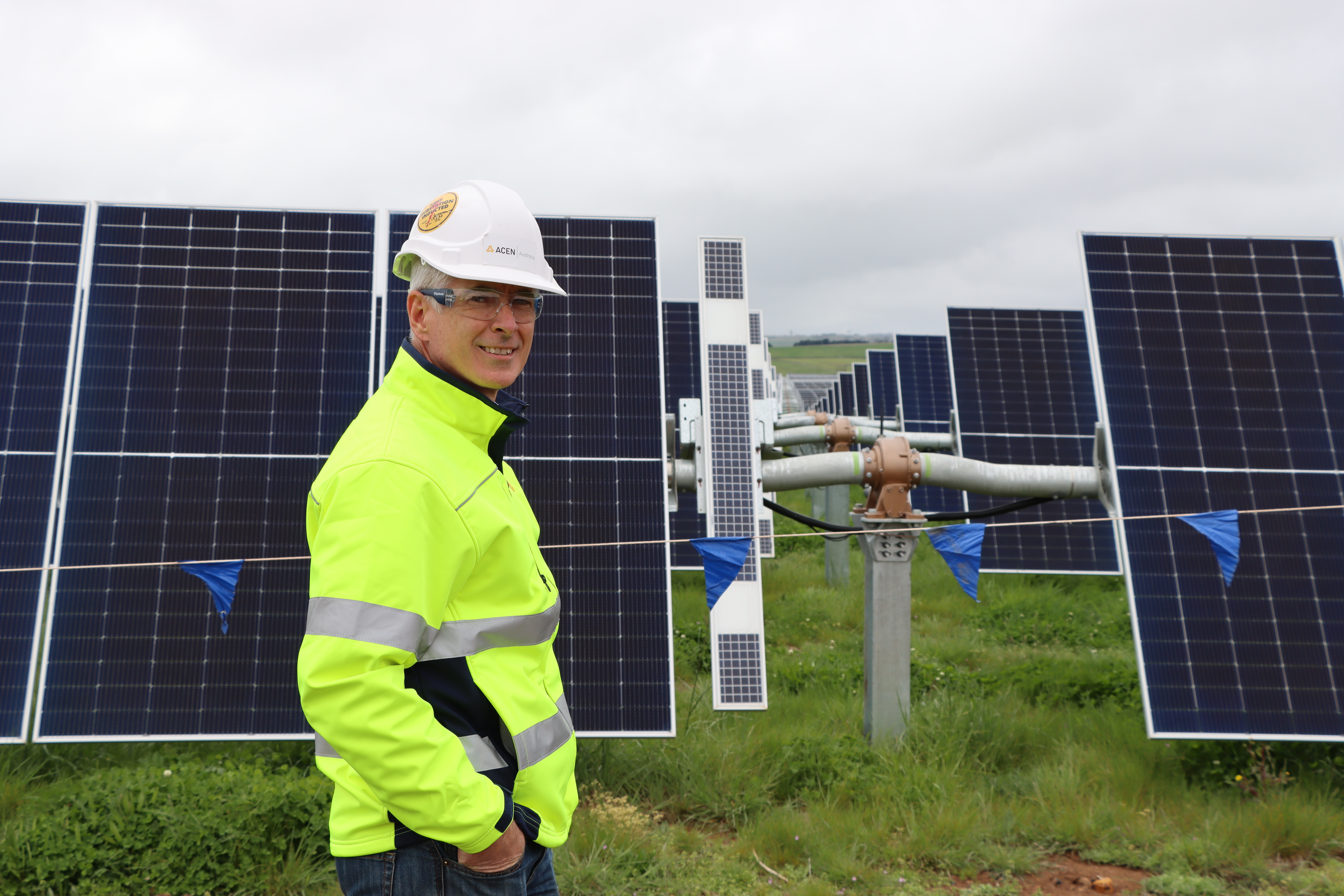 ACEN Australia Construction Manager Tim Greenaway inspects completed solar panels.