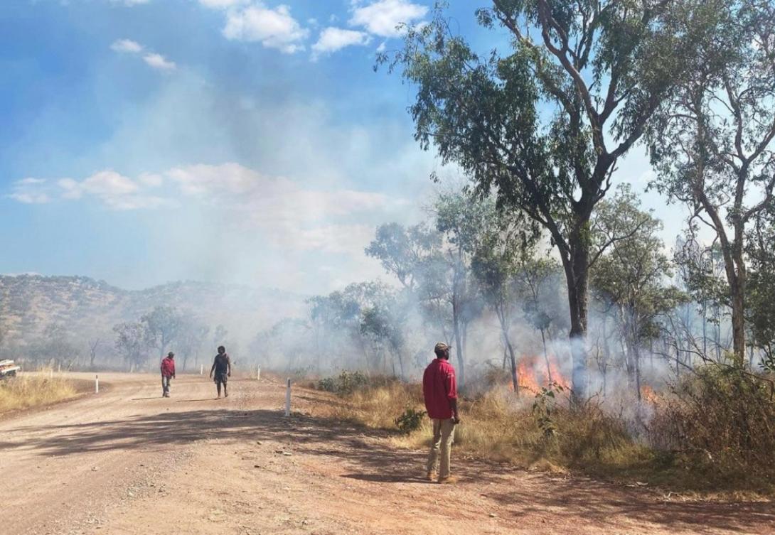 Nyaliga rangers on Country monitoring a controlled early dry season burn, as part of their accredited training.